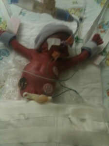 Here she is. All purple, all covered in cords and cables and stickers and all beautiful. She still has a scar from one of her stickers holding a cord in place. It's her tickle button.